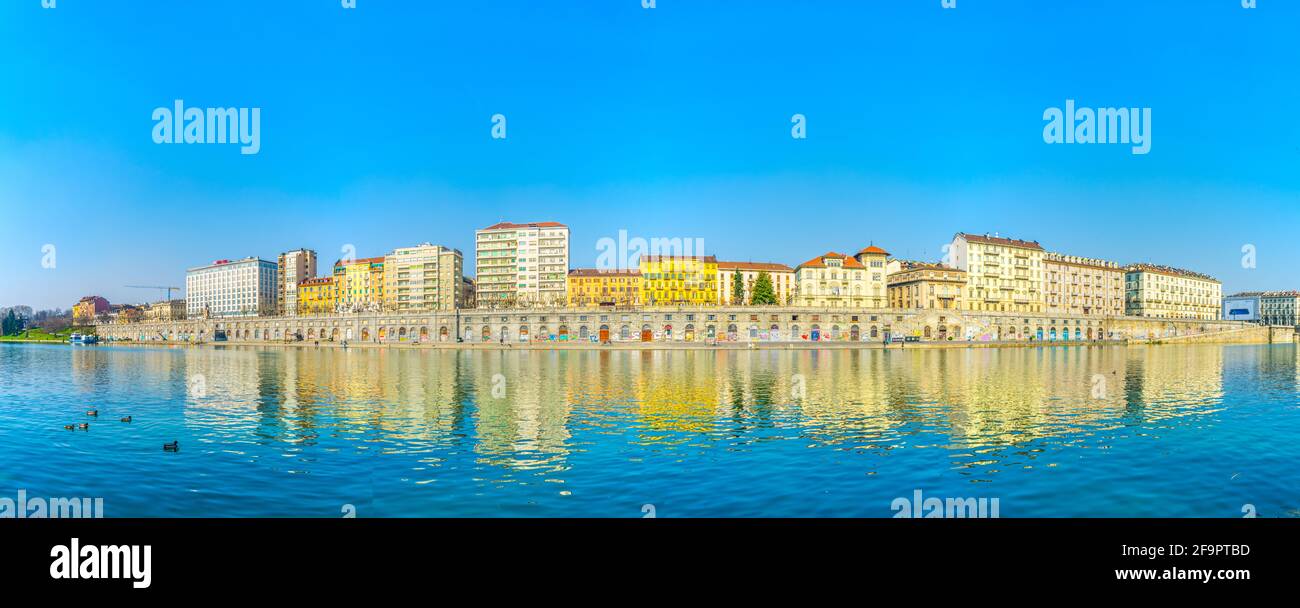 historical buildings stretched along riverside of po river in the ...