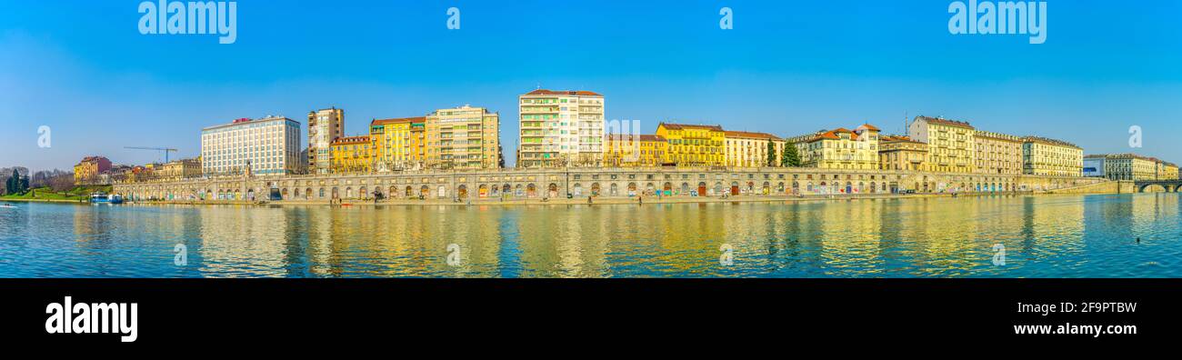 historical buildings stretched along riverside of po river in the ...