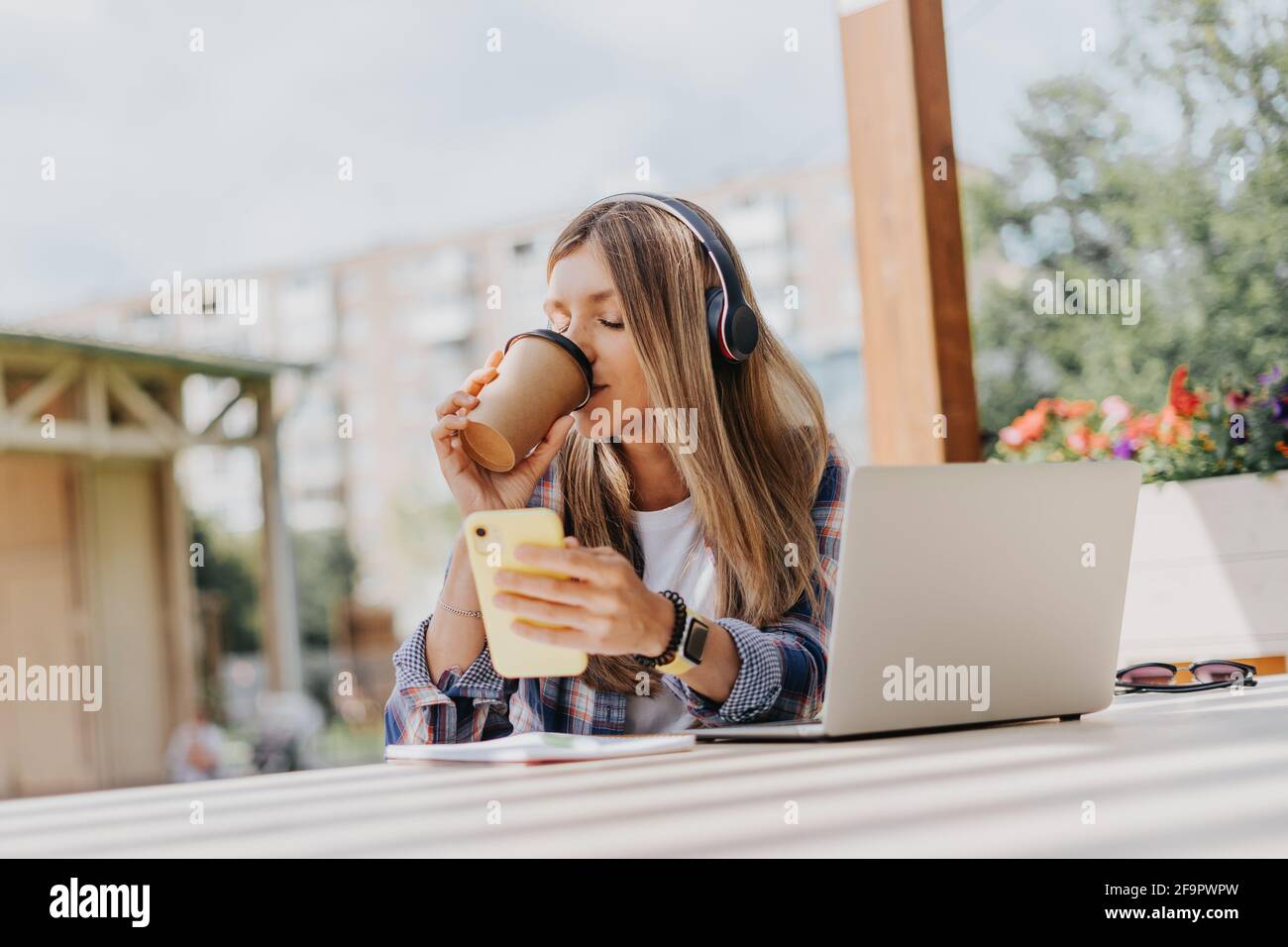 Woman in headphones having a video call Stock Photo - Alamy