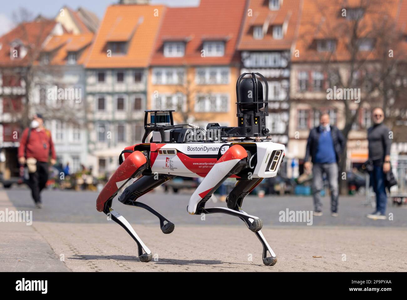 Erfurt, Germany. 20th Apr, 2021. Spot, a robot with dog-like movements,  walks across the Domplatz. The security service provider Ciborius, supplier  of robotic security solutions with artificial intelligence, presented its  artificial employee