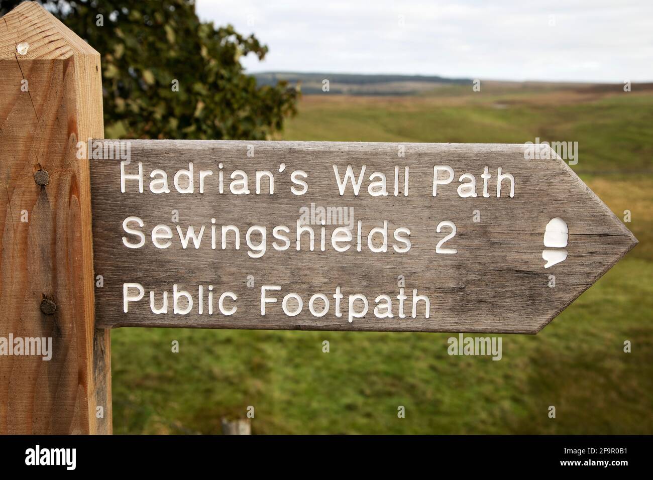 Sign on Hadrian's Wall Path in Northumberland, England. The public footpath runs 2 miles to Sewingshields. Stock Photo