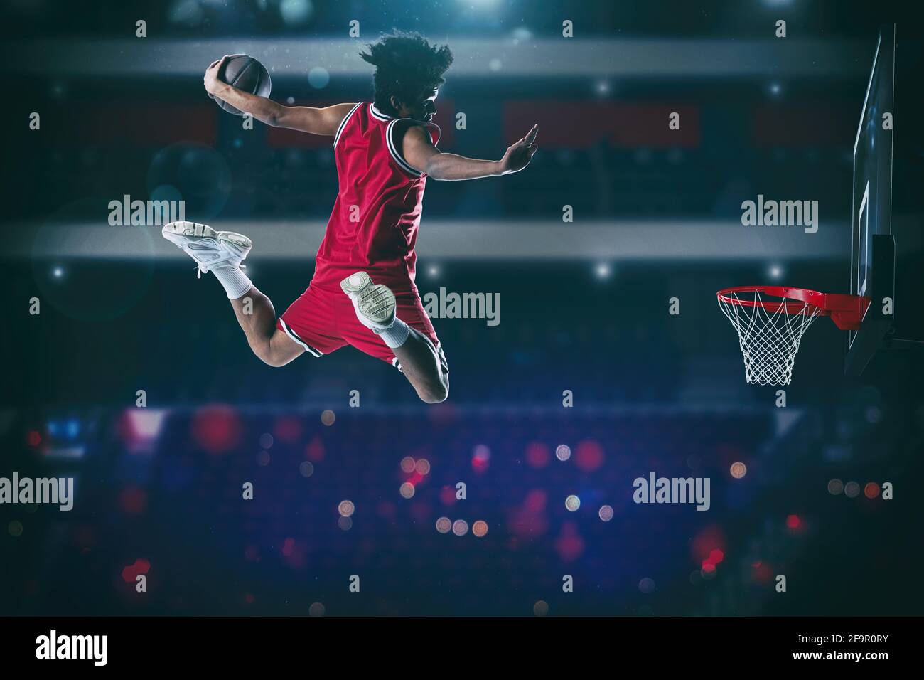 Basketball game with a high jump player to make a slam dunk to the