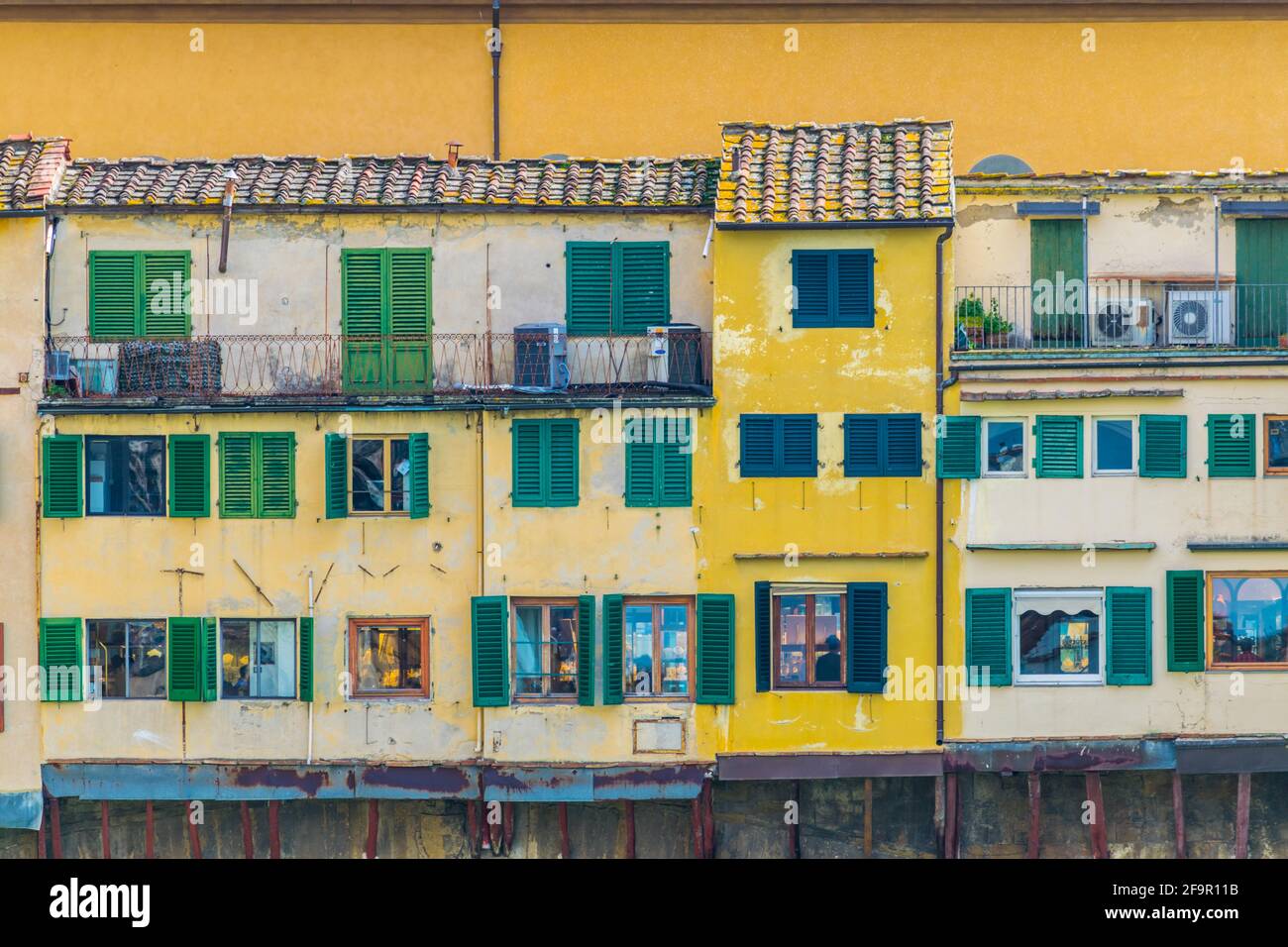 detail of colorful houses on the ponte vecchio bridge in the italian