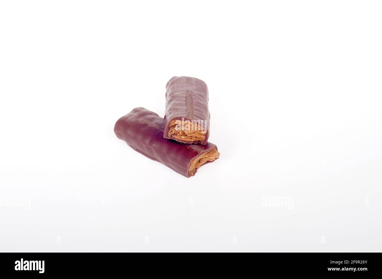 5th Avenue Candy Bar from The Hershey Company with Peanut Butter Crunch and Milk Chocolate out of Wrapper isolated on White Stock Photo