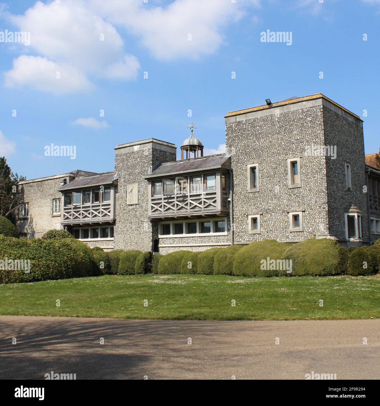 West Dean College near Chichester, West Sussex. The former home of surrealist Edward James. Photograph taken on beautiful spring day. Stock Photo
