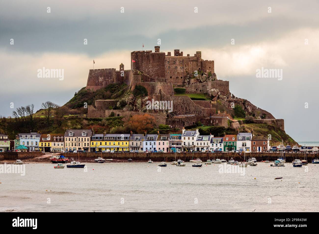Mount Orgueil castle over the Gorey village, Saint Martin, bailiwick of Jersey, Channel Islands Stock Photo