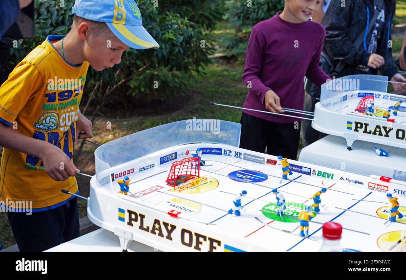 Kiev, Ukraine September 1, 2019 A boy plays table hockey. Street
