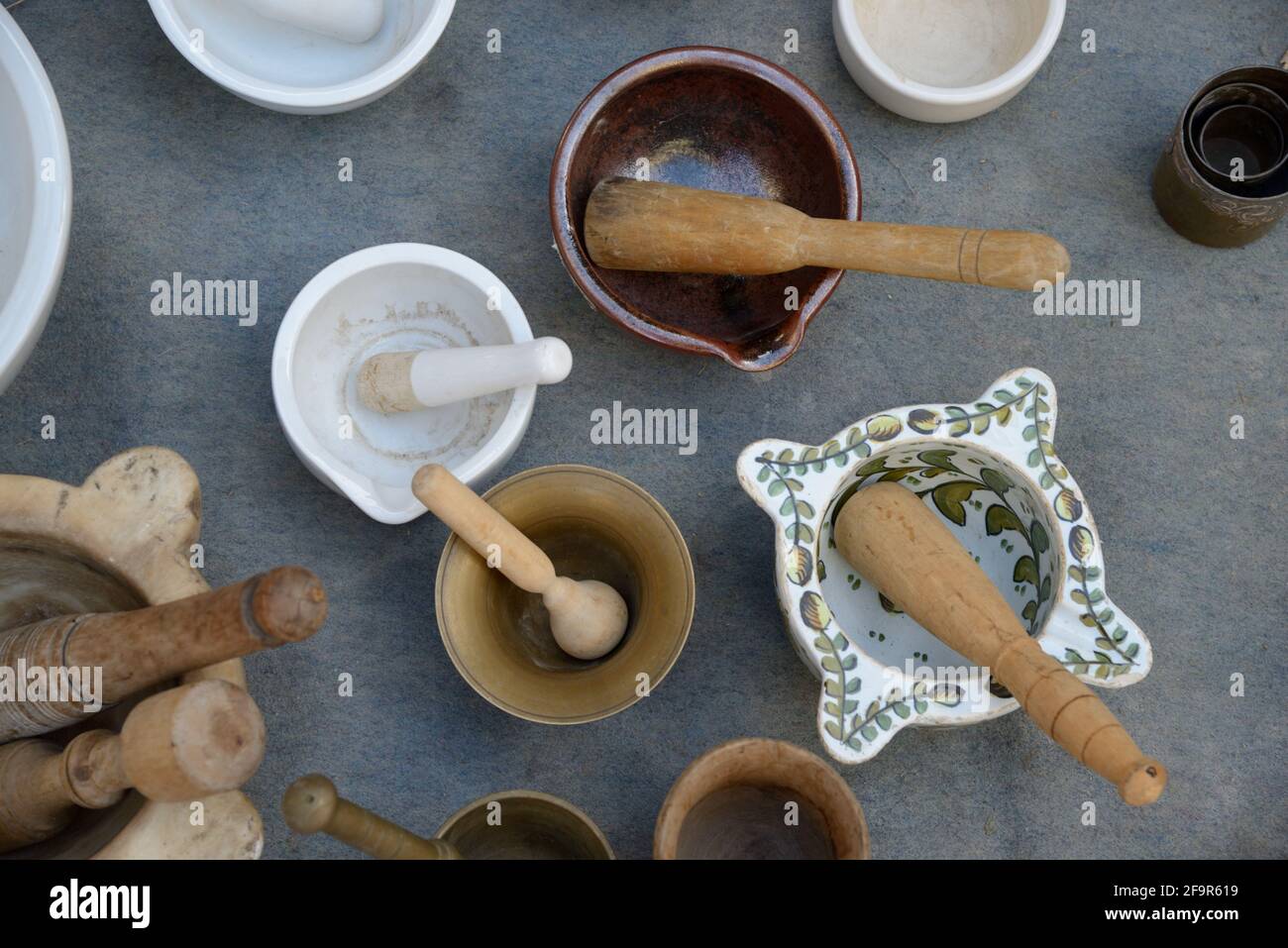Display of Collectible, Vintage or Old Mortars and Pestles, or Mortar and Pestle, at Antique Fair or Brocante France Stock Photo