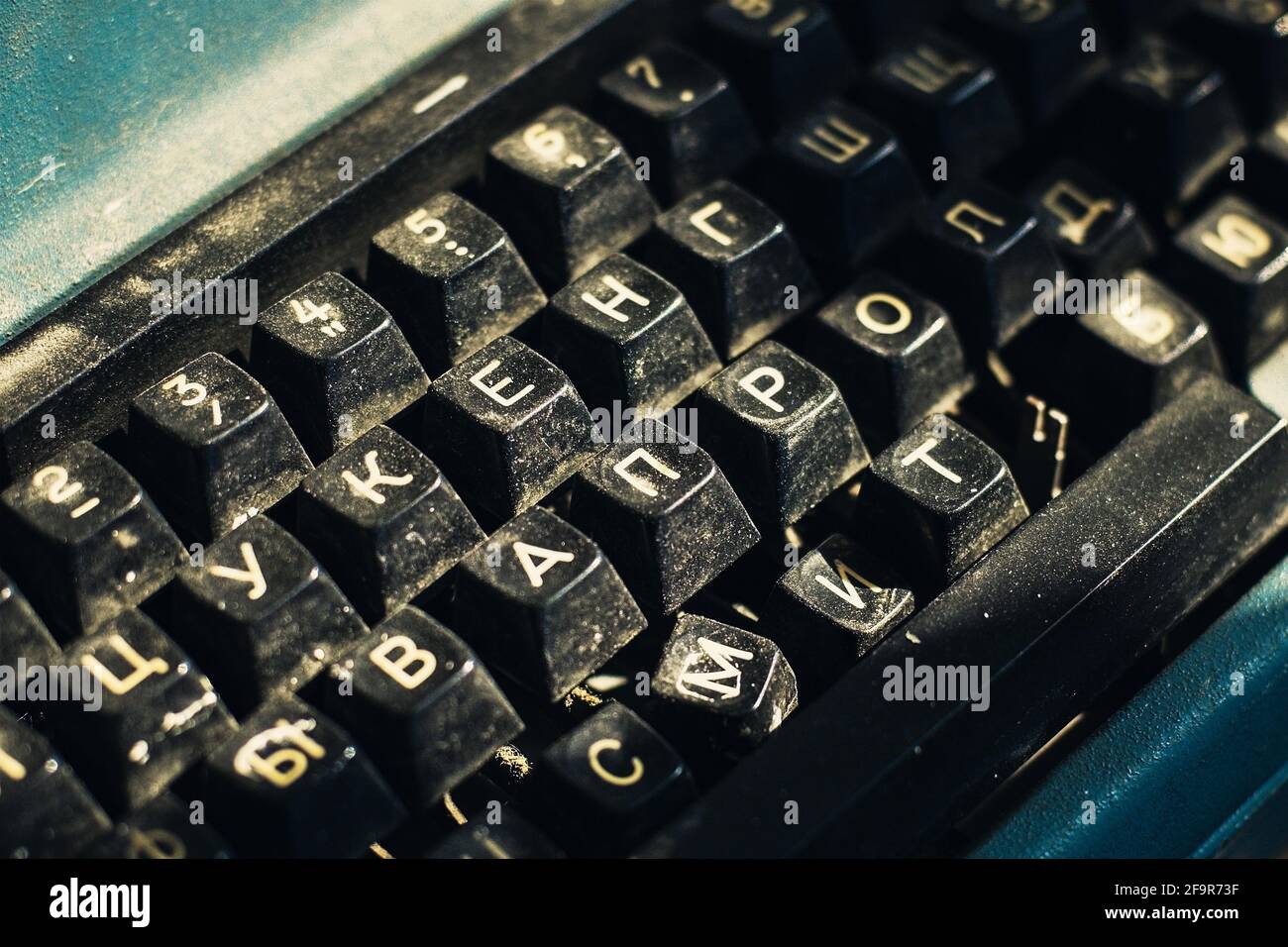 An old typewriter with the Russian alphabet. Close-up of the buttons. Stock Photo