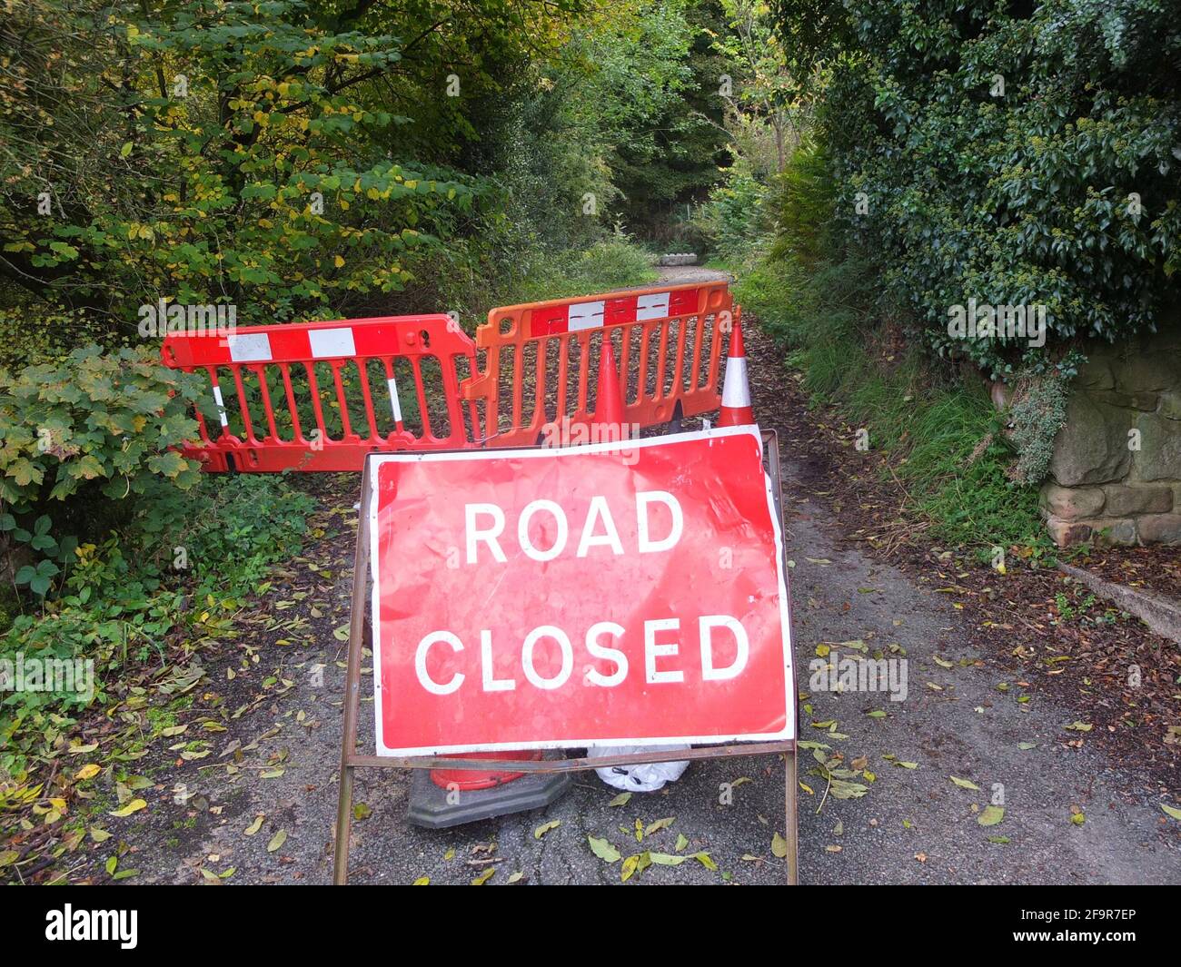 Sign for a road closure on a remote rural road at Stanton Lees in Derbyshire, it has been closed owing to a landslip Stock Photo