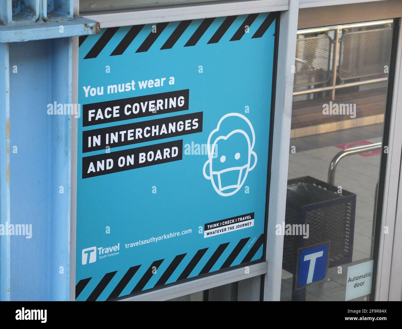 Sign at Sheffield Interchange bus station saying that face coverings are mandatory on buses and inside station to help prevent spread of Covid 19 Stock Photo