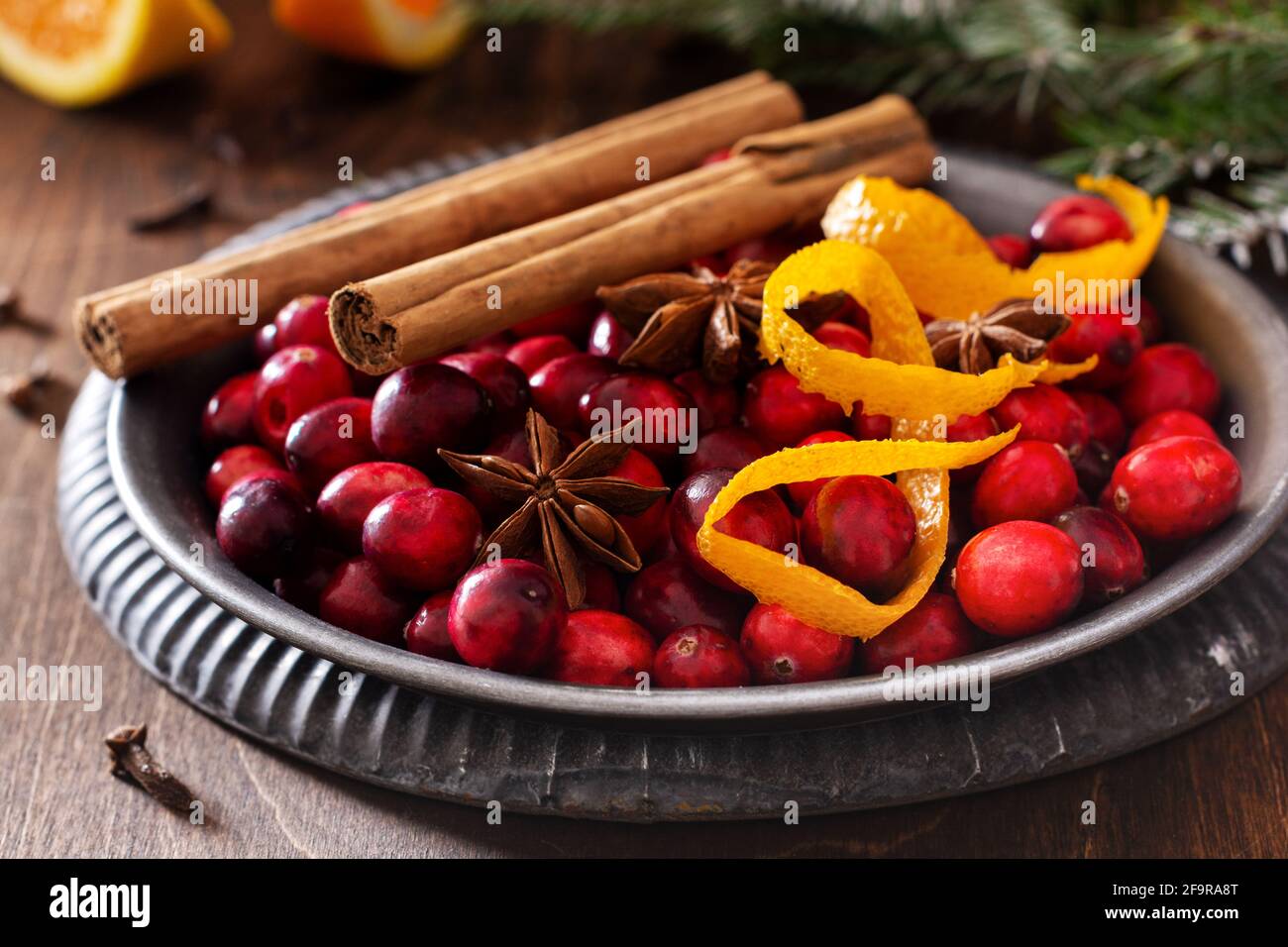 Ingredients for making mulled wine with cranberries. Orange, cinnamon
