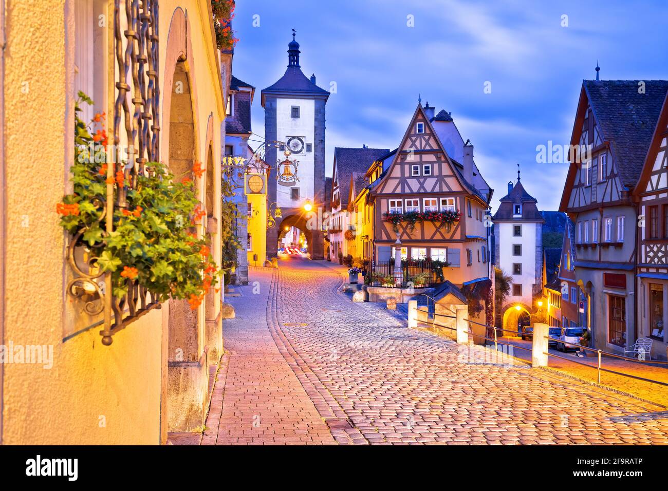Famous Plonlein gate and cobbled street of historic town of Rothenburg ob der Tauber evening view, Romantic road of Bavaria region of Germany Stock Photo