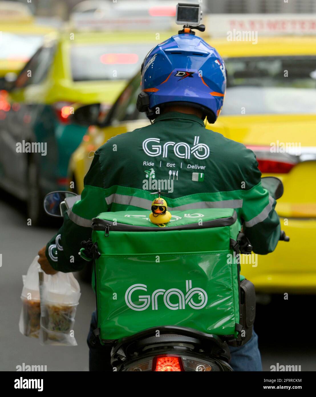 Bangkok, Thailand. 20th Apr, 2021. A Grab motorcycle rider seen making