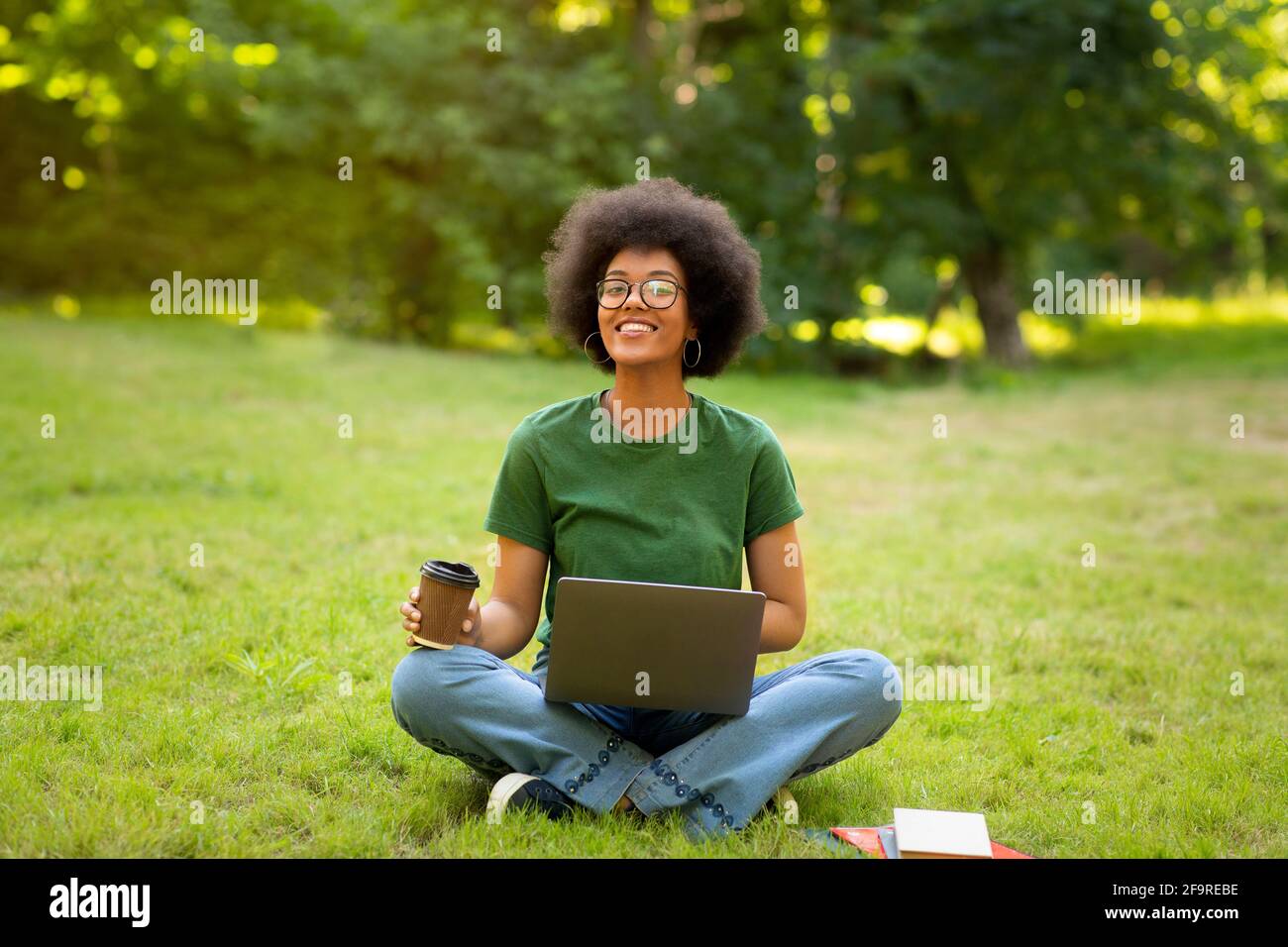 Rest At Campus. African Student Girl Relaxing Outdoors With Coffee And Laptop Stock Photo