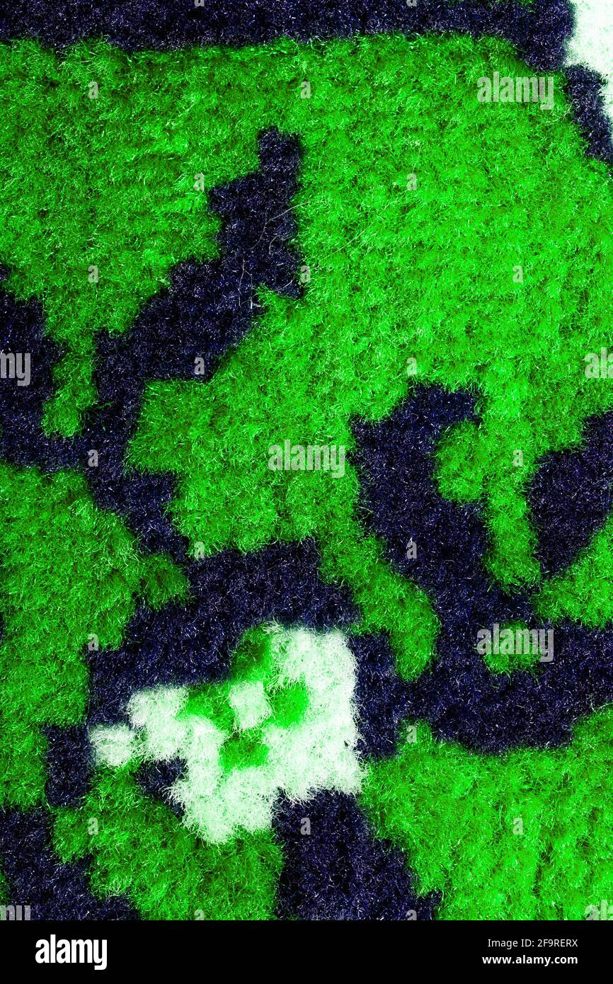 Hand woven carpet pattern, close up view. Stock Photo
