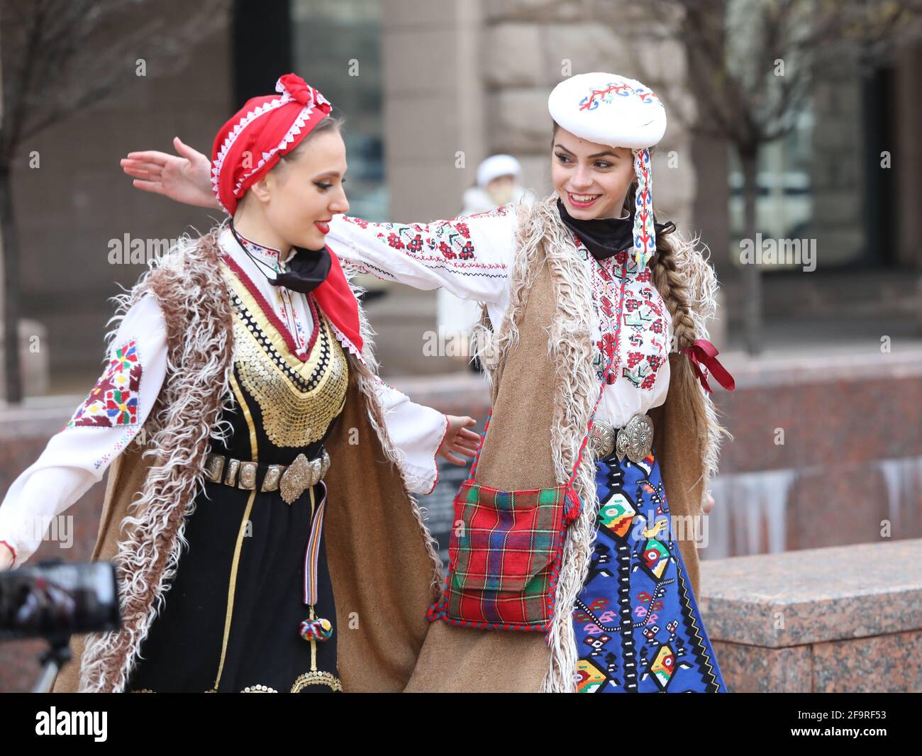 People in traditional folk costumes perform the Bulgarian folk dance 'Horo' in the center of Sofia, Bulgaria Stock Photo
