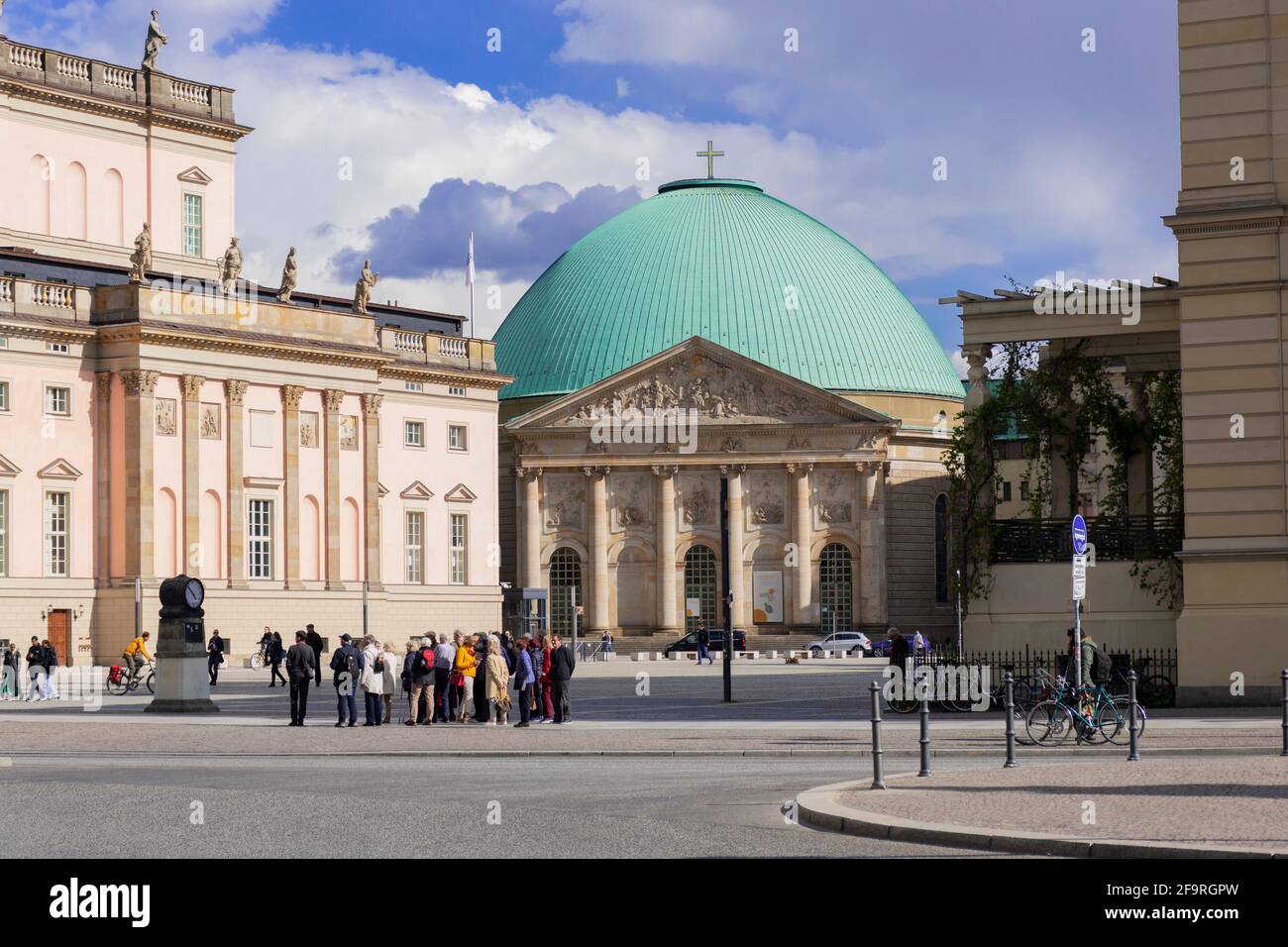13 May 2019 Berlin, Germany - Group of tourists, St. Hedwig's Cathedral or Sankt Hedwigs Kathedrale, Roman Catholic cathedral, Bebelplatz. Stock Photo