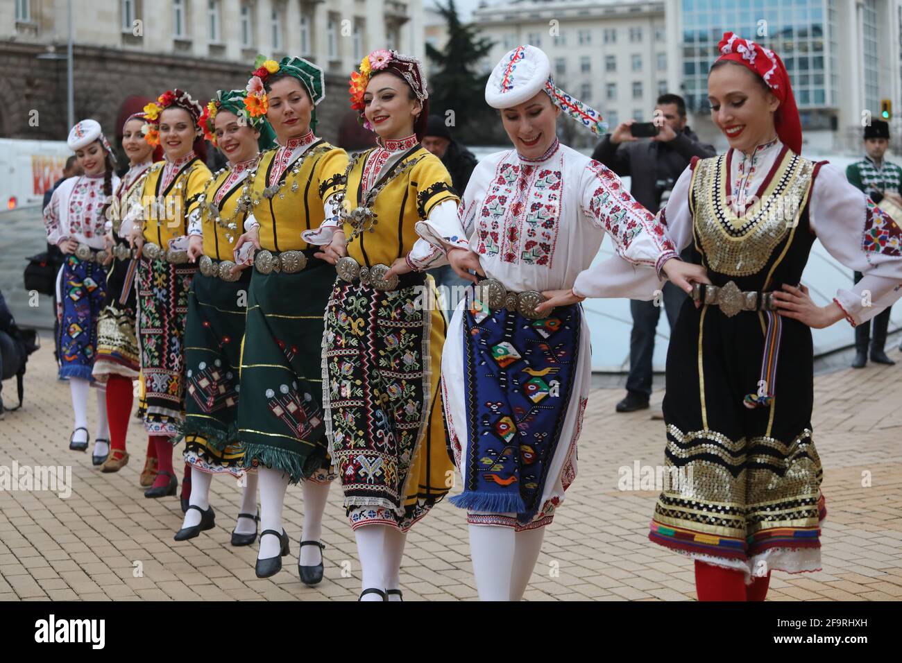 People in traditional folk costumes perform the Bulgarian folk dance 'Horo' in the center of Sofia, Bulgaria Stock Photo