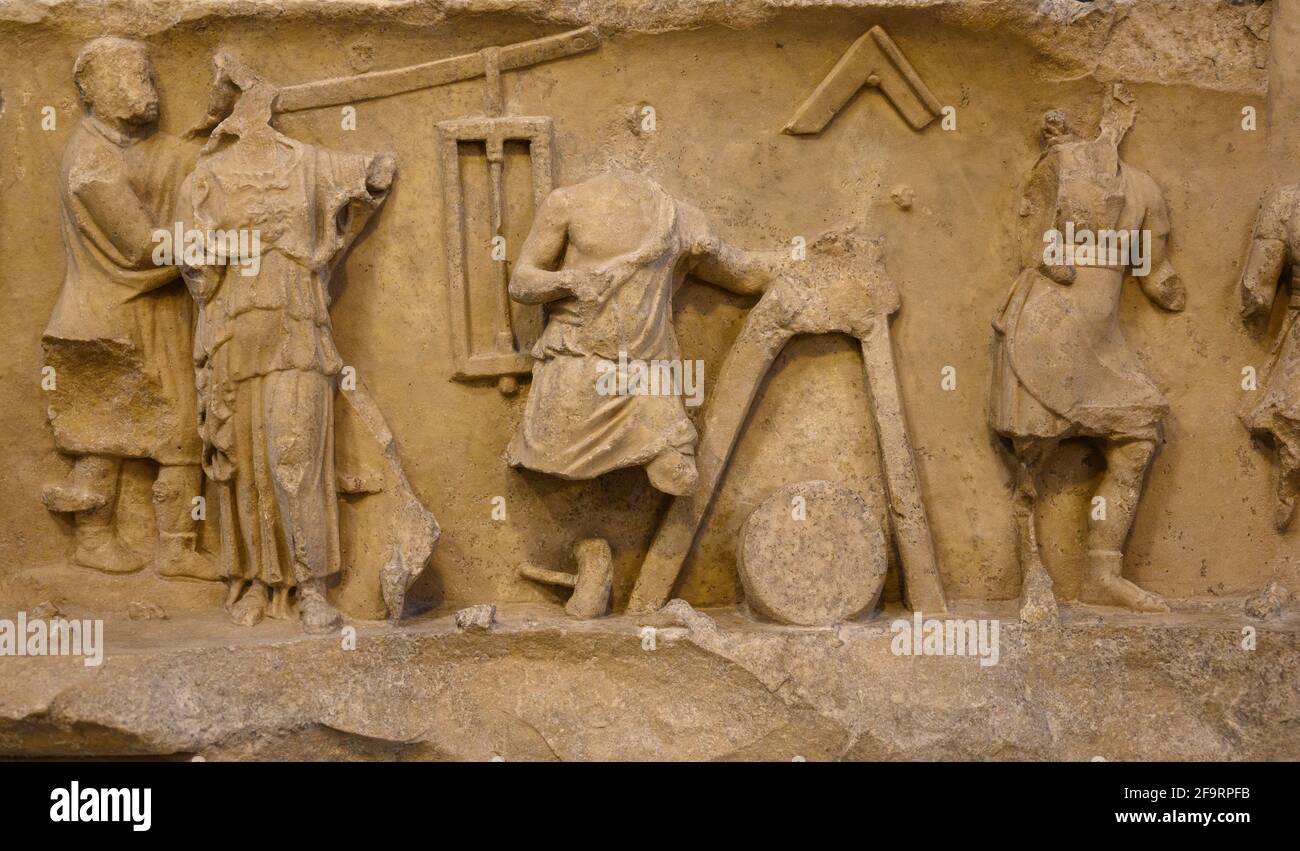 Rome. Italy. Frieze from the college of the Fabri Tignarii. The frieze shows a work scene in a carpenters' shop. The carpenters' guild, which had cons Stock Photo