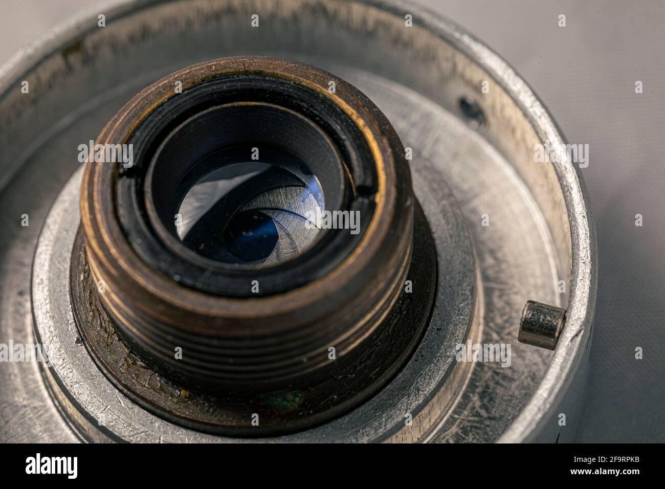 Old, vintage film camera lens close up macro shot. The iris diaphragm