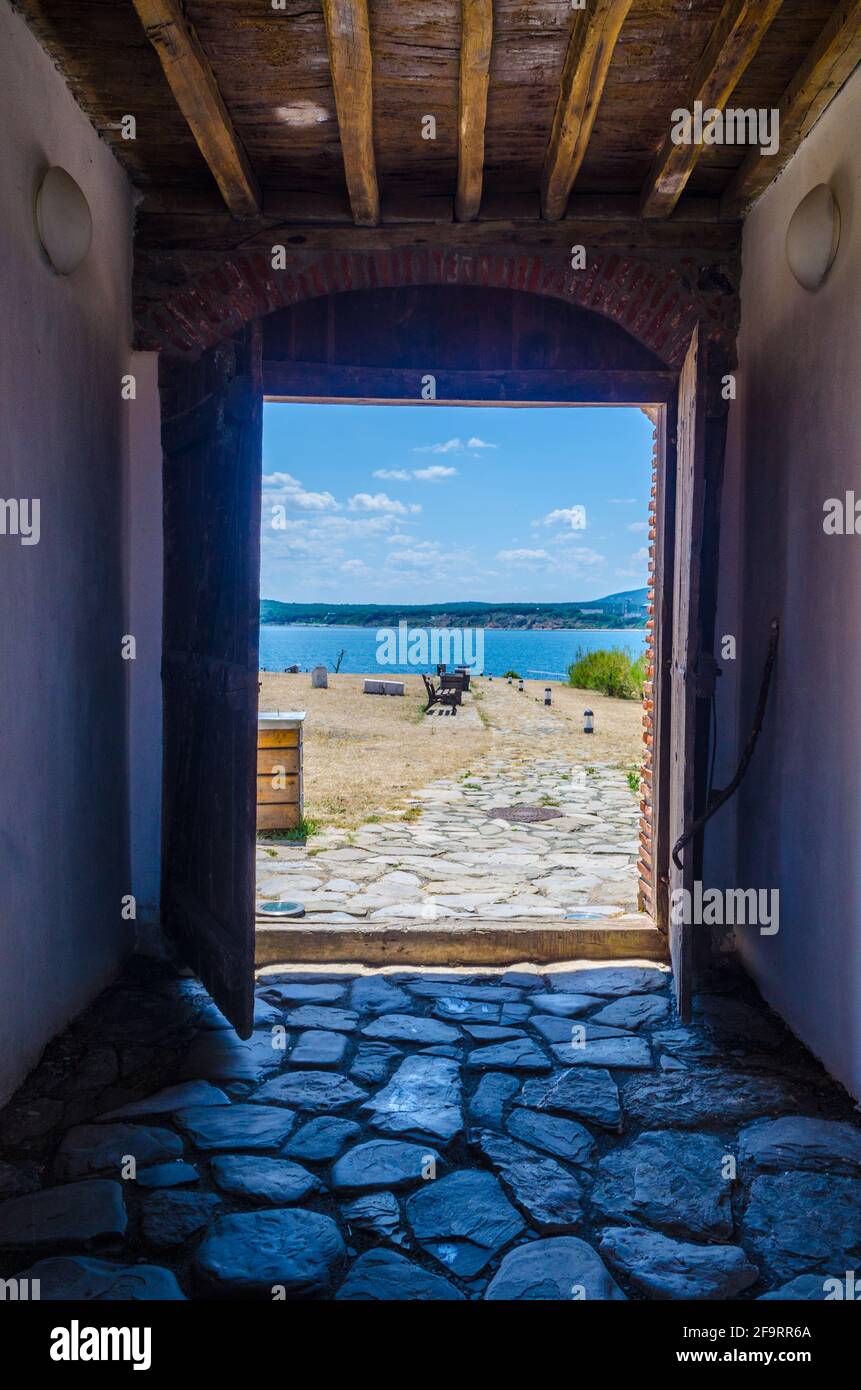 view through an open wooden door on the bulgarian island saint anastasia. Stock Photo