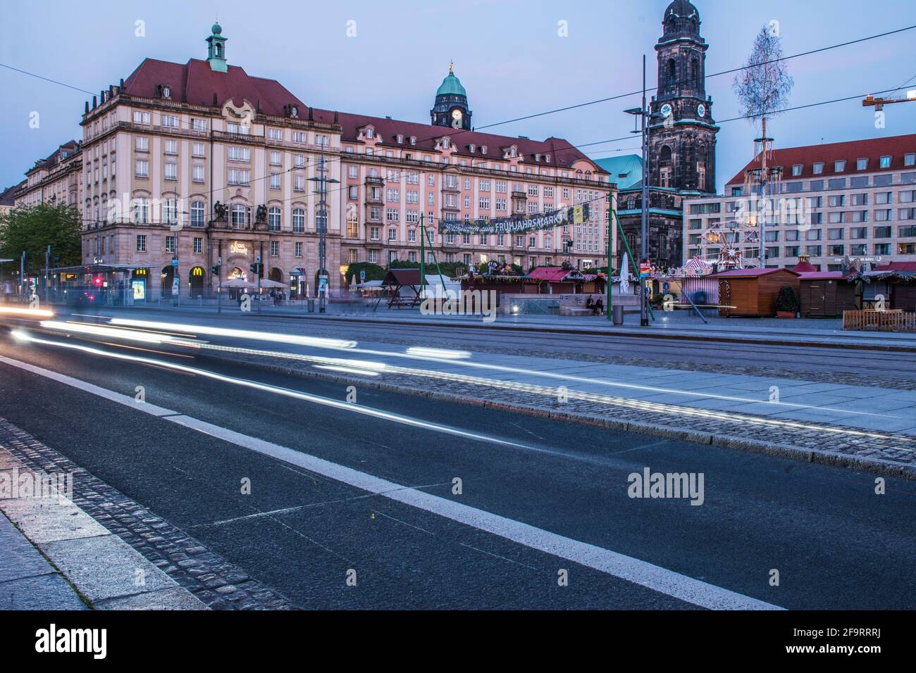 17 May 2019 Dresden, Germany - City street at night with a moving tram creating light trails. Public city transport of Dresden. Stock Photo