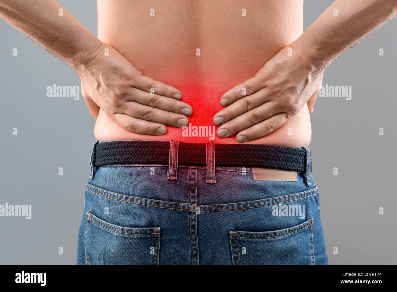 Closeup of unrecognizable man rubbing his low back Stock Photo Alamy
