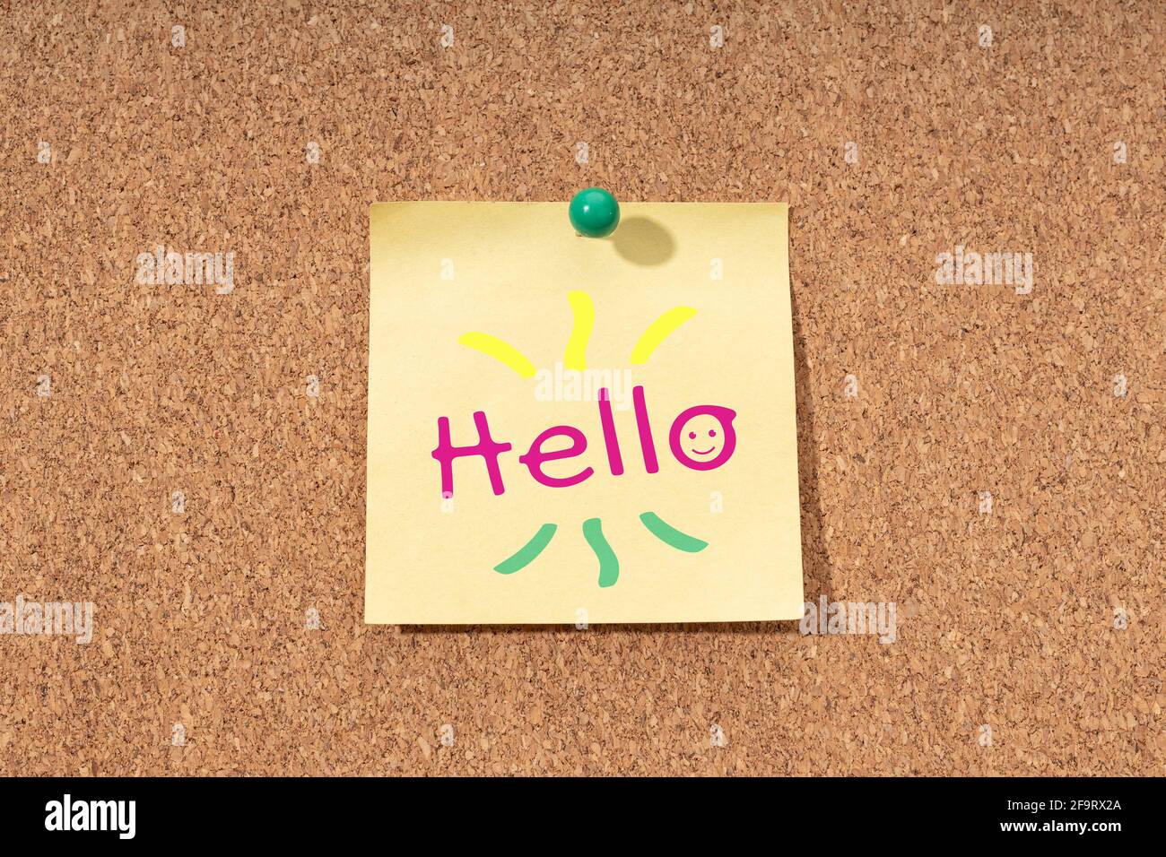 Hello word on yellow note on cork board Stock Photo