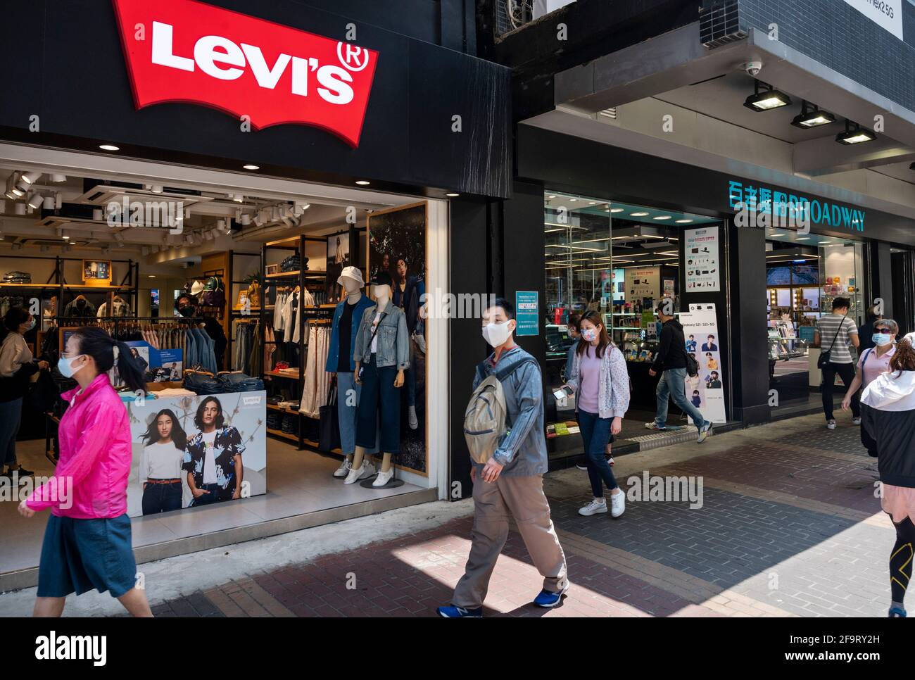 Pedestrians walk past Levi's logo and store in Shibuya, Tokyo. (Photo by  Stanislav Kogiku / SOPA Images/Sipa USA Stock Photo - Alamy