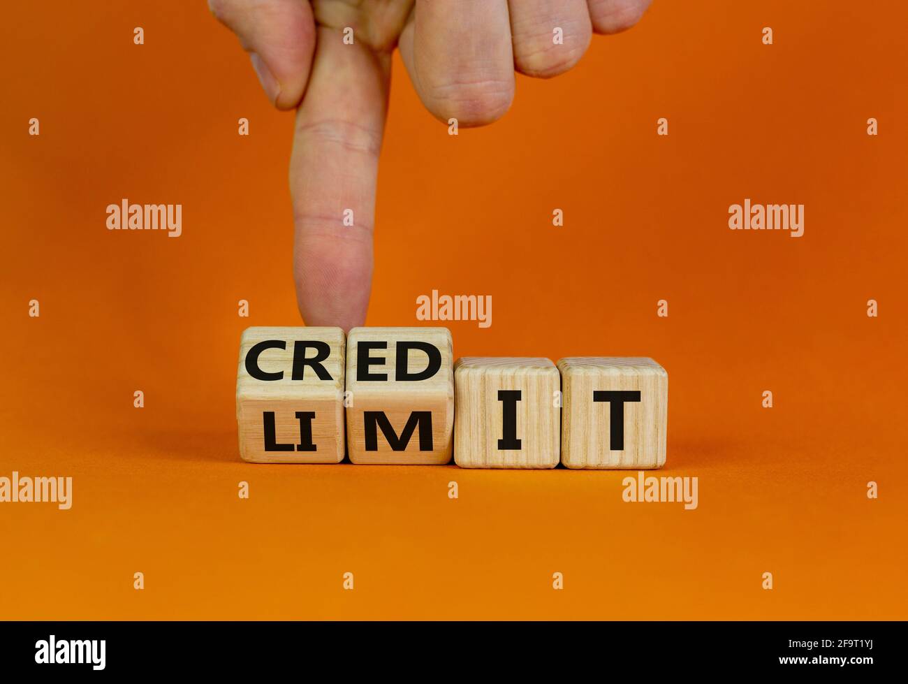 Credit limit symbol. Businessman turns wooden cubes and changes the ...