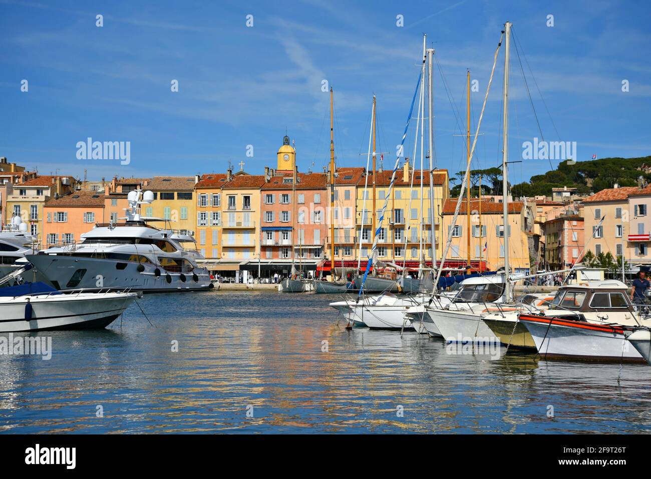 Scenic view of the Old Port with the typical Provençal architecture and luxury sail boats in Saint-Tropez, French Riviera France. Stock Photo