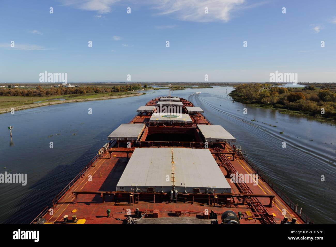 Bulk carrier vessel proceeding in inland waters for loading Stock Photo