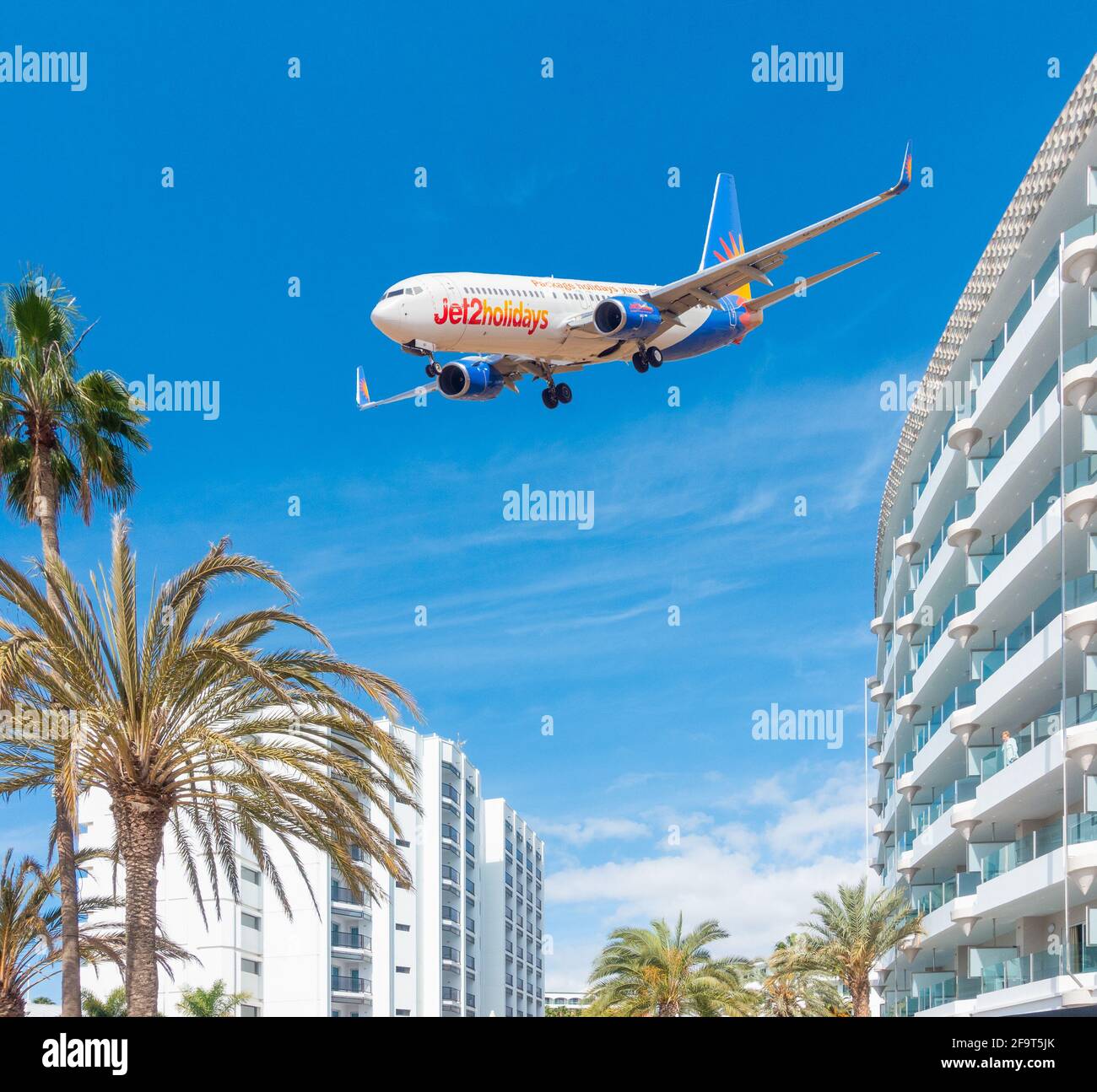 Jet 2.com airplane, aircraft flying over hotel in Spain. Composite image. Stock Photo