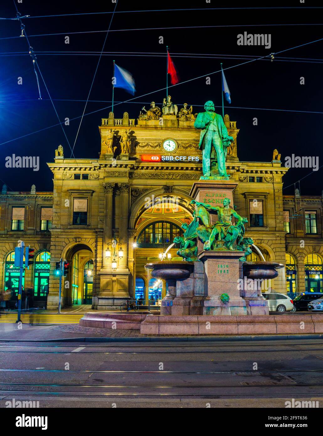 night view of the main railway station in zurich and statue of alfred escher Stock Photo