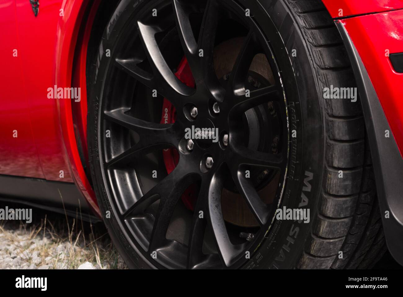 Red Challenger With Black Rims