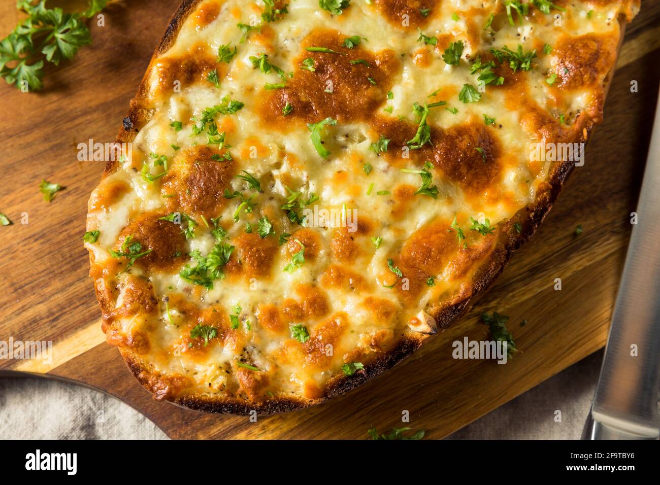 Homemade Cheesy Bread on a French Loaf with Garlic Stock Photo Alamy