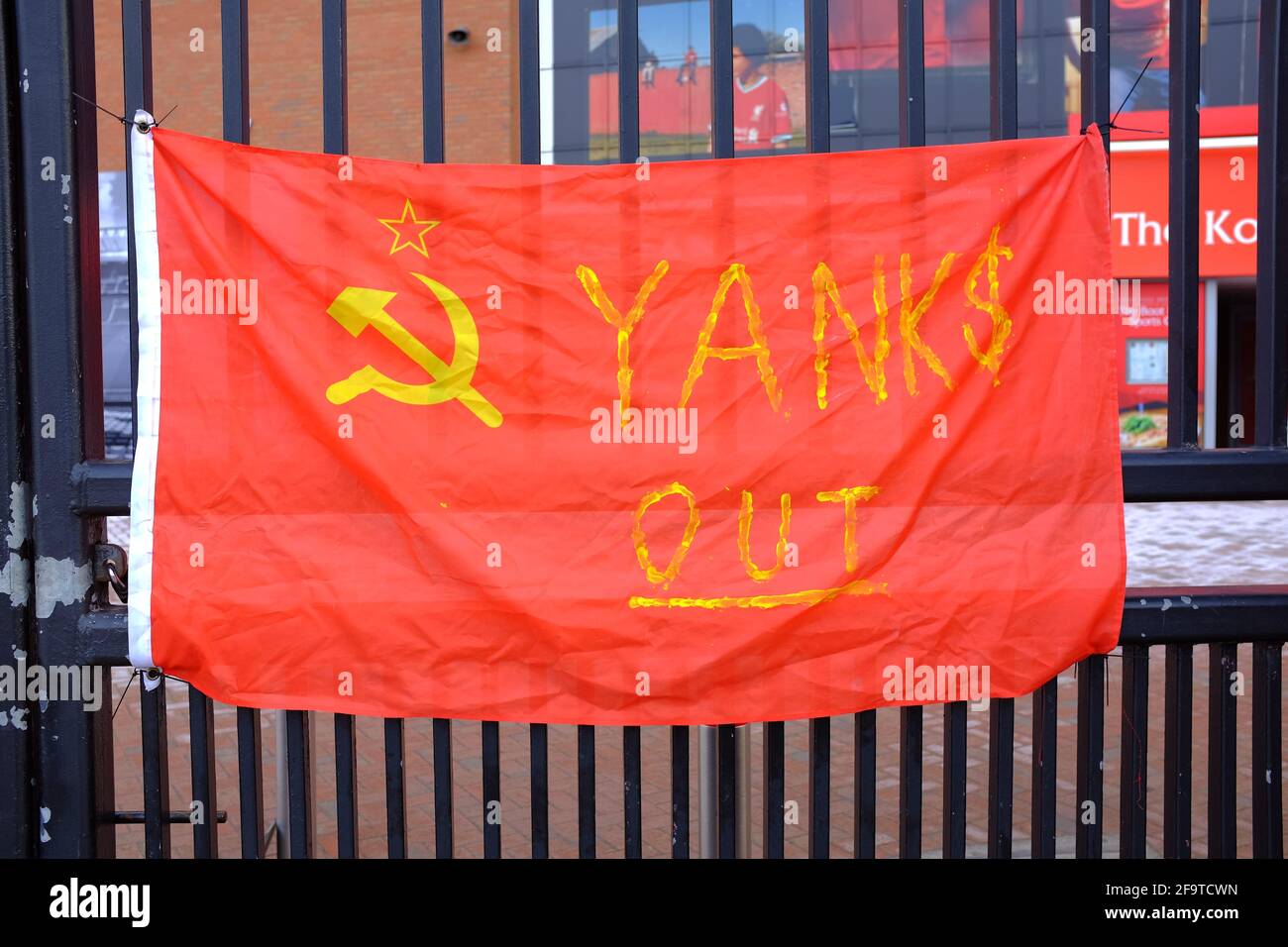 Banners attached to the perimeter  fence of Liverpool Football Club by fans protesting about the clubs intention to join a European Super League. Stock Photo