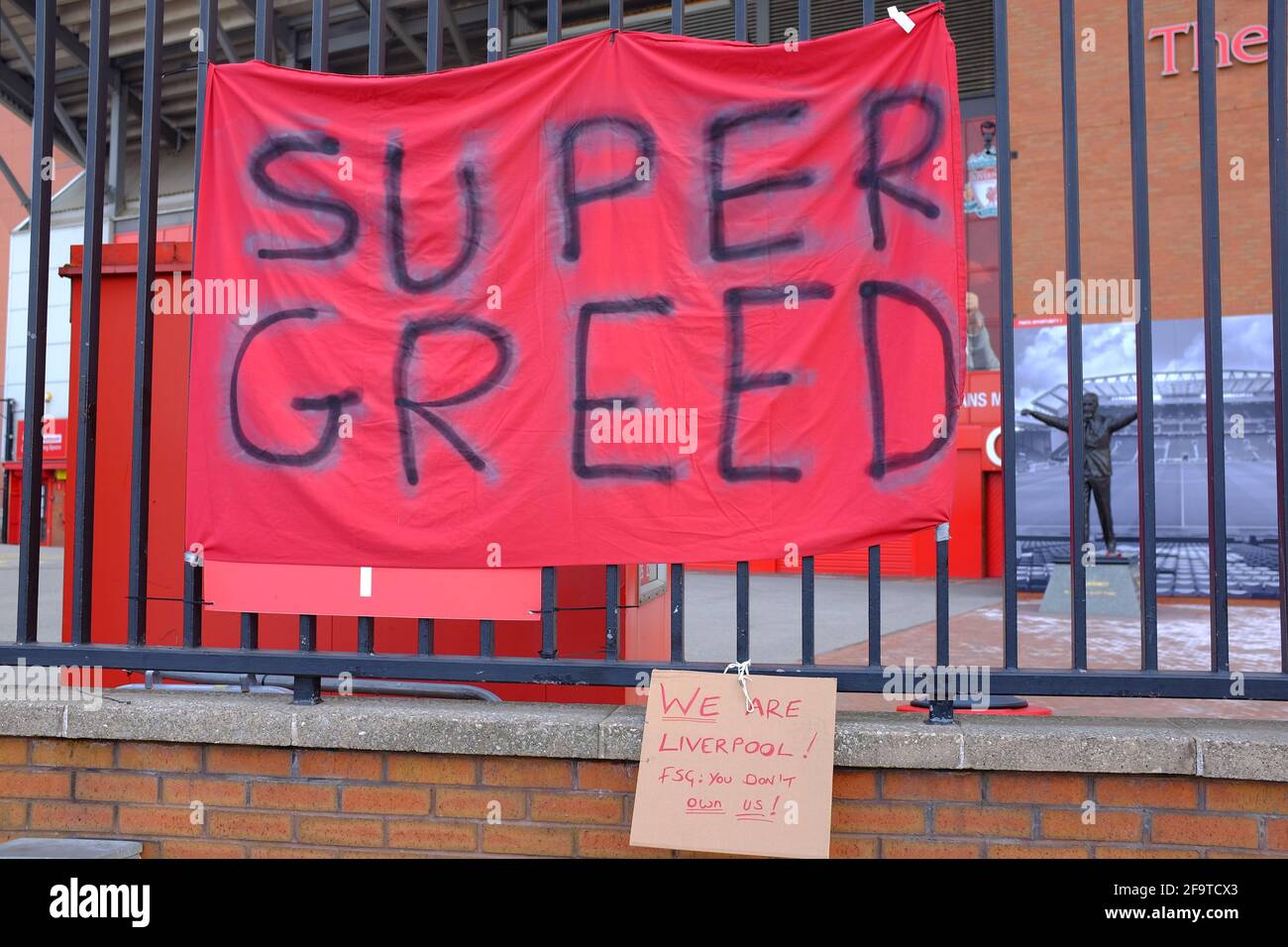 Banners attached to the perimeter  fence of Liverpool Football Club by fans protesting about the clubs intention to join a European Super League. Stock Photo