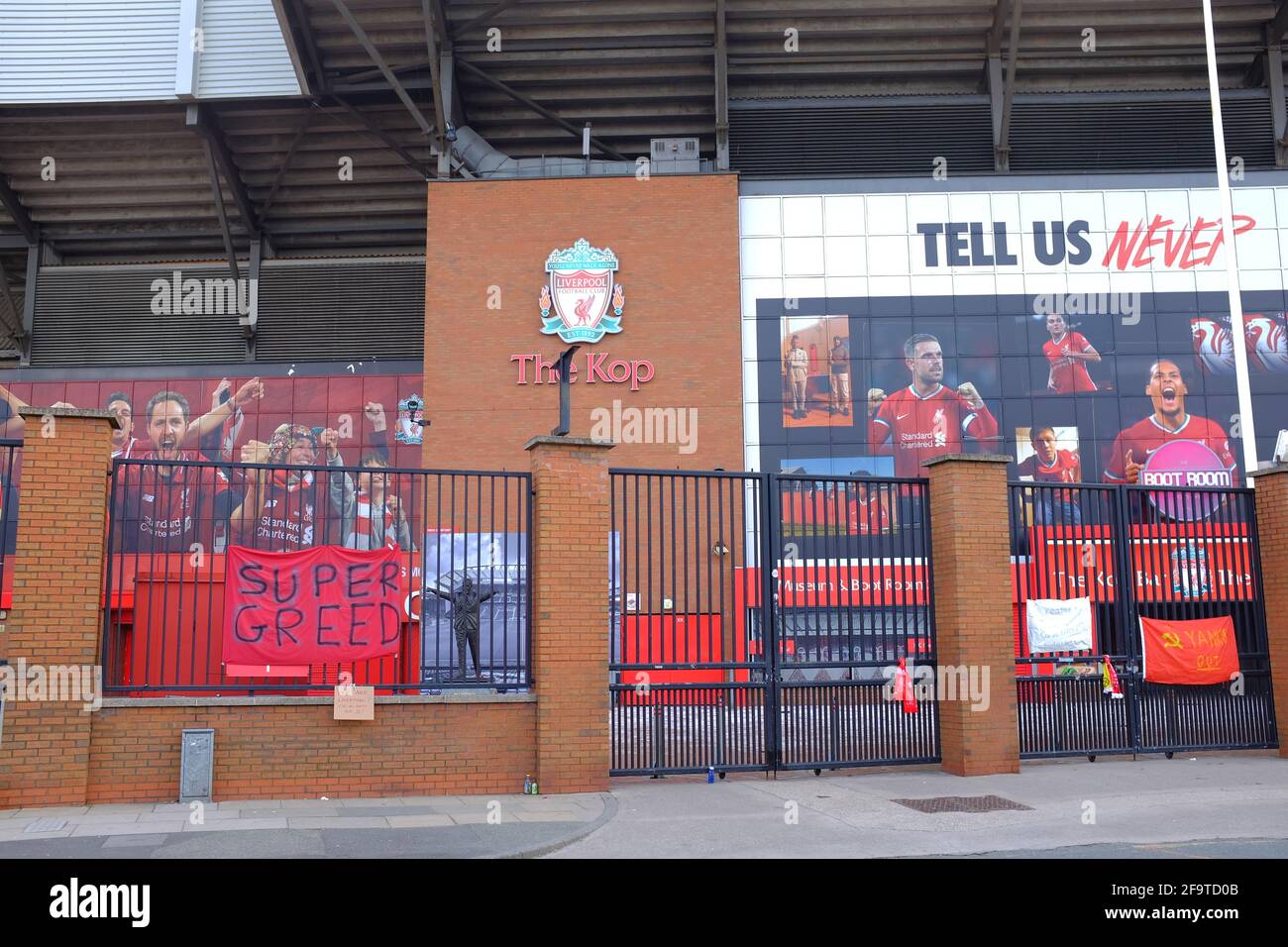 Banners attached to the perimeter  fence of Liverpool Football Club by fans protesting about the clubs intention to join a European Super League. Stock Photo