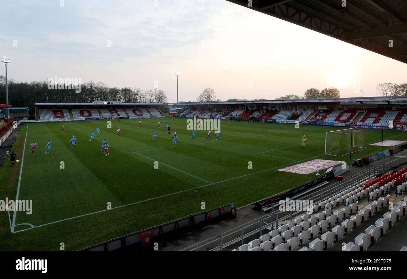 Match action in front of empty stands during the Sky Bet League Two match at the Lamex Stadium, Stevenage. Picture date: Tuesday April 20, 2021. Stock Photo