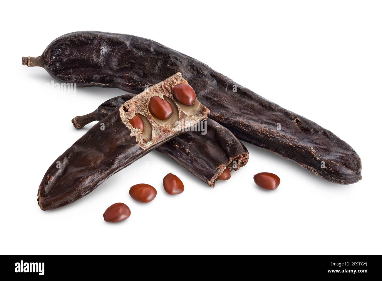 Ripe carob pods and bean isolated on white background with clipping