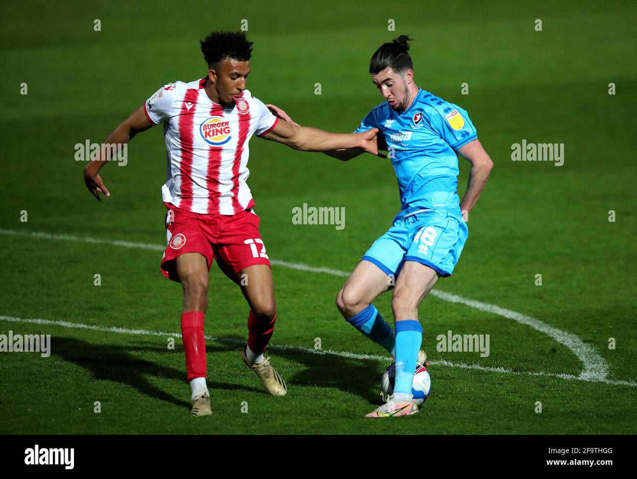 Stevenage's Remeao Hutton (left) and Cheltenham Town's Finn Azaz battle for the ball during the Sky Bet League Two match at the Lamex Stadium, Stevenage. Picture date: Tuesday April 20, 2021. Stock Photo