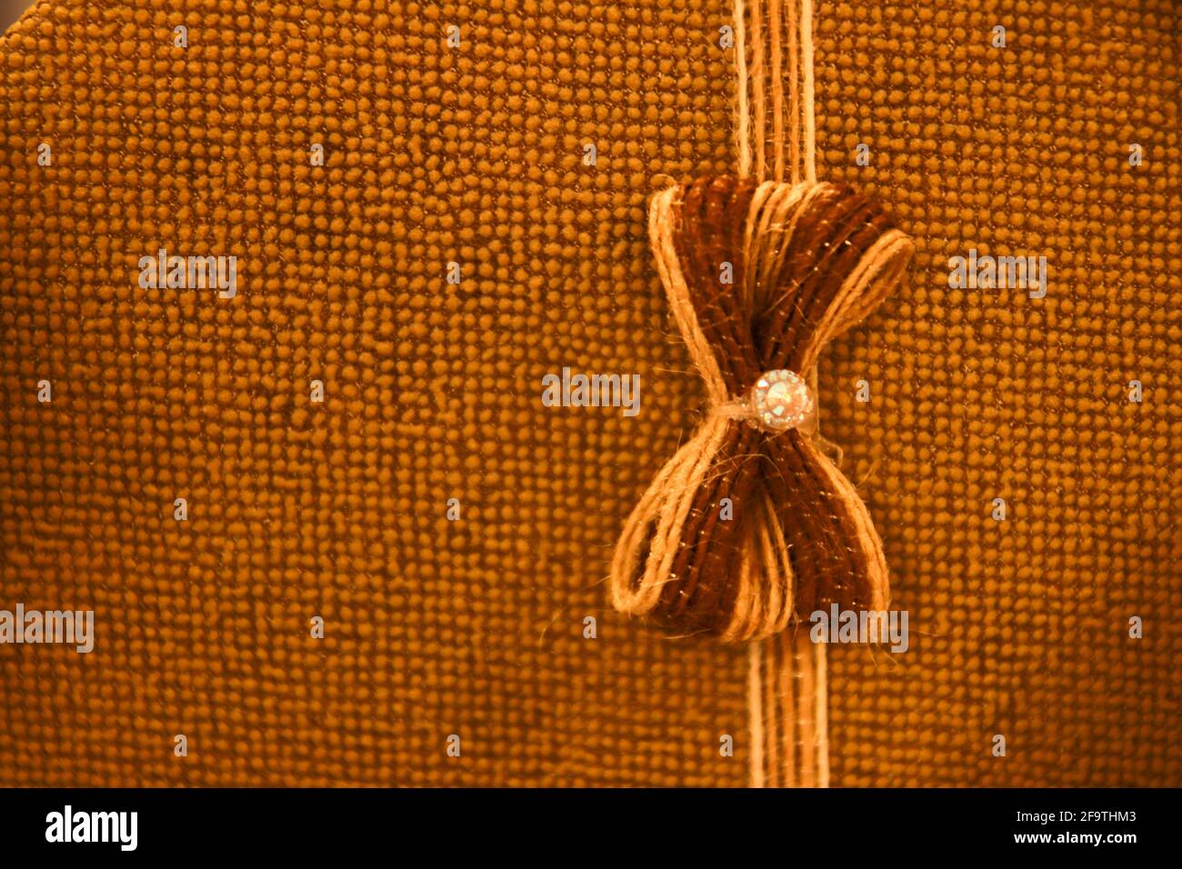 Brown background with a bow on the right side Stock Photo