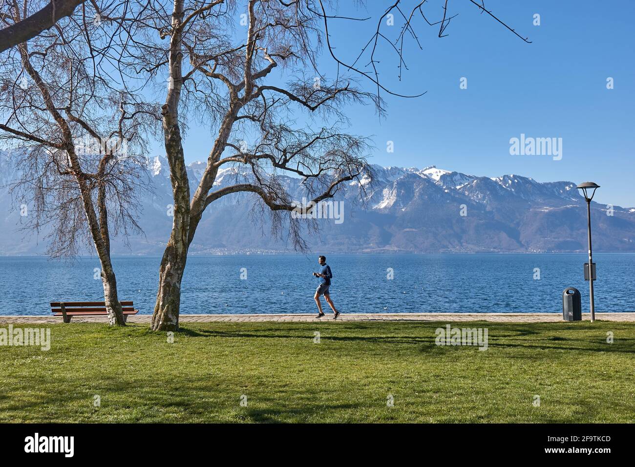 Morning run on the shore of Lake Geneva Stock Photo
