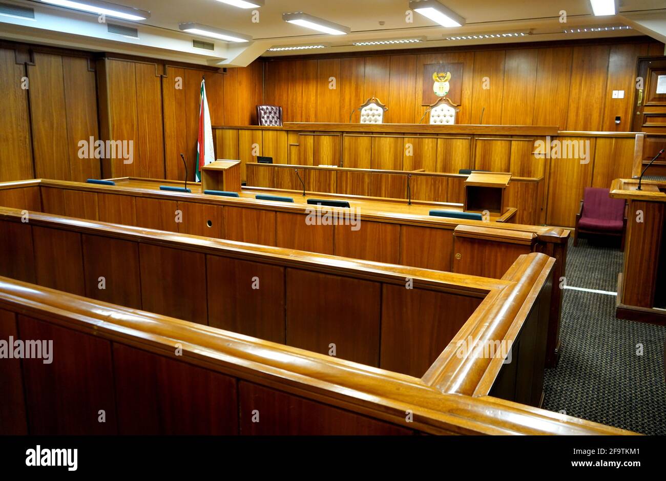 Interior of a courtroom, wood paneled Stock Photo