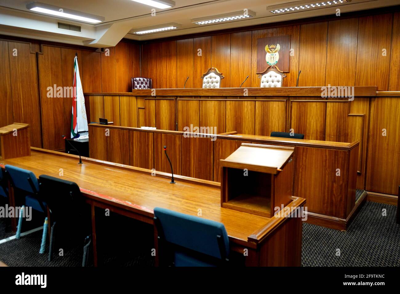Interior of a courtroom, wood paneled Stock Photo