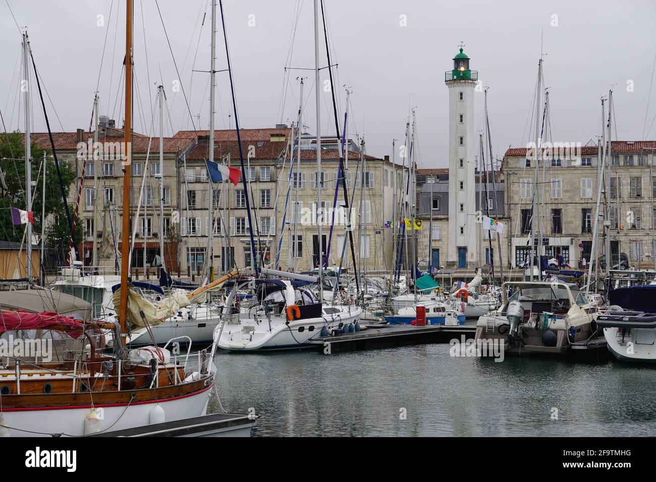 downtown La Rochelle, France by the harbor and lighthouse Stock Photo
