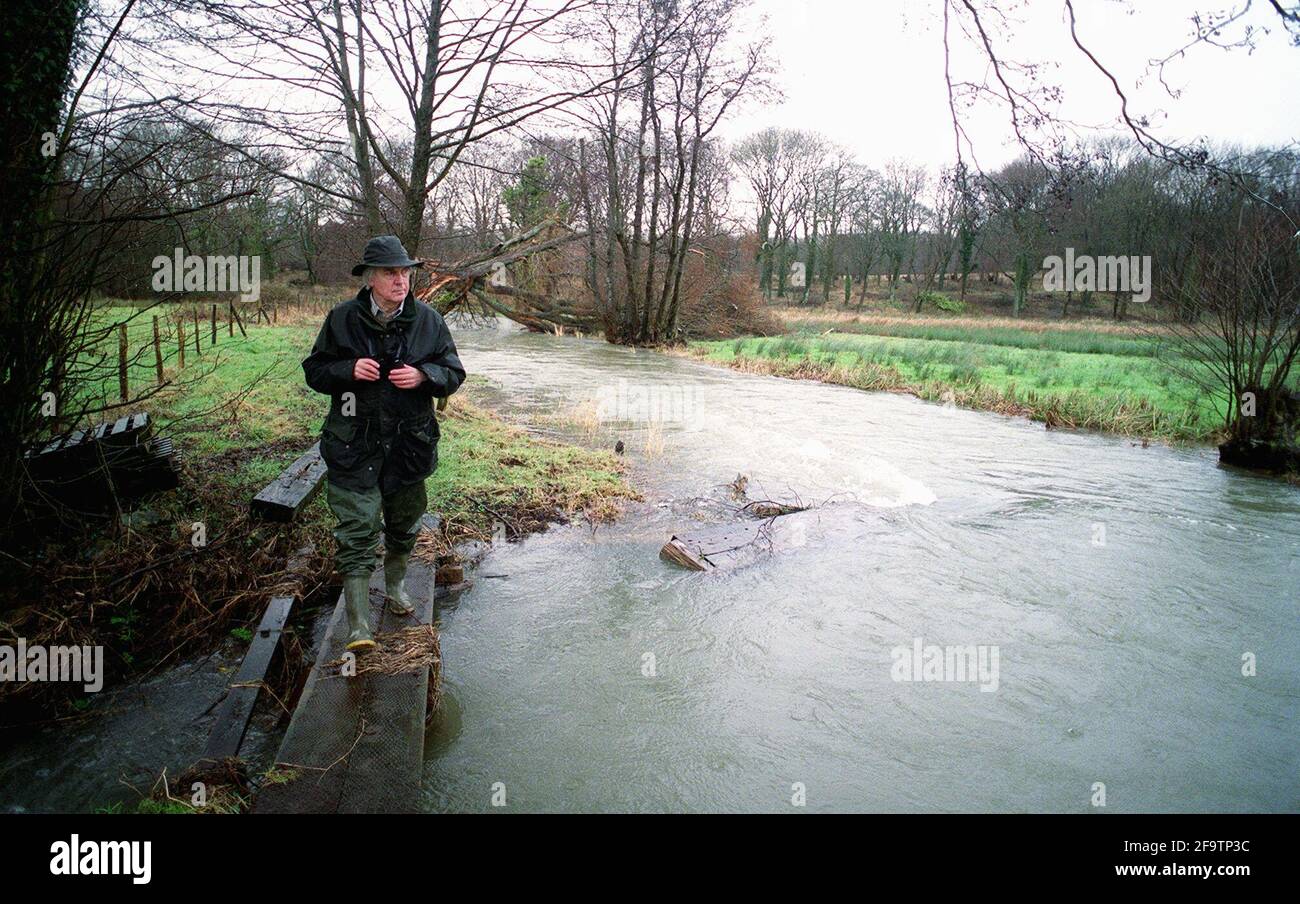 Brian Clarke  March 2001Writer/ Author by an unusually swollen river Meon in Hampshire Stock Photo