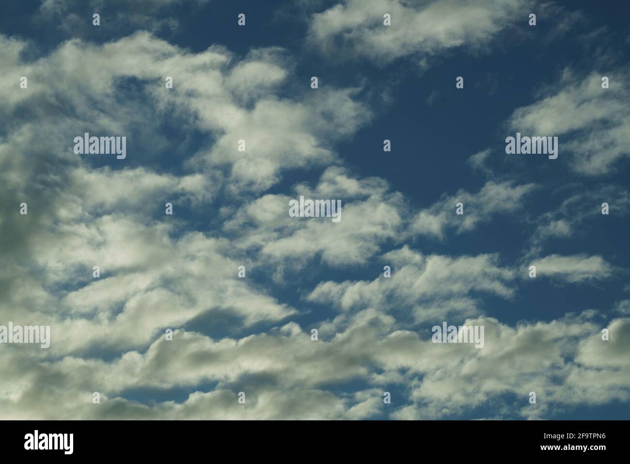 white fluffy clouds in the blue sky Stock Photo - Alamy